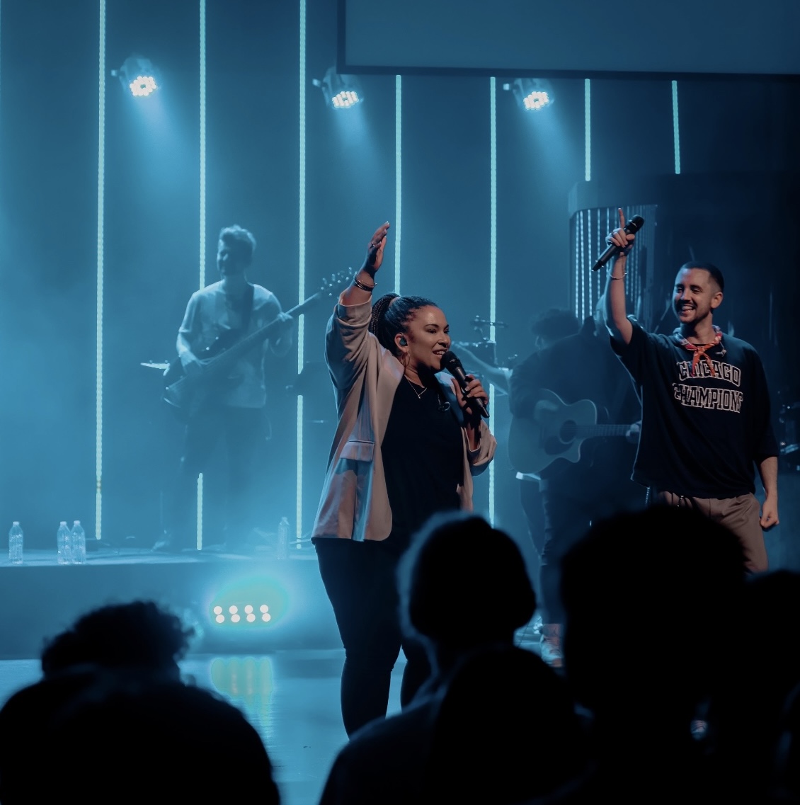 Jessica Hitte singing and leading worship on stage